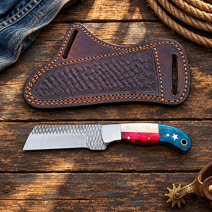Red-white-blue cowboy knife and sheath in a Western flat lay